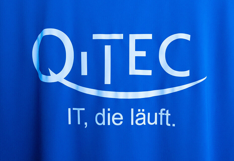 QITEC-Banner mit Logo und Slogan: IT, die läuft.